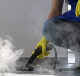 professional-cleaning-service-person-using-steam-cleaner-office